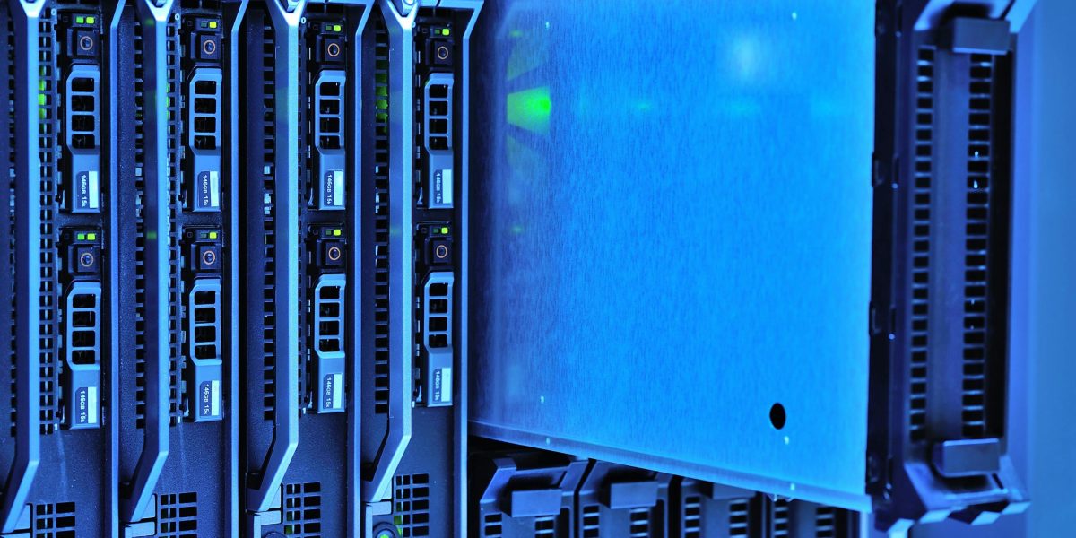 Detailed view of server racks with glowing lights in a data center environment.